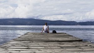 Girl sitting on a dock